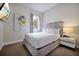 Inviting bedroom with a comfortable bed, a modern bedside table, and a large window at 7740 Sandy Ridge Dr # 114, Reunion, FL 34747