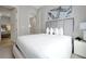 Serene bedroom with a plush bed, neutral tones, and elegant artwork above the headboard at 7740 Sandy Ridge Dr # 114, Reunion, FL 34747