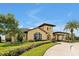 A beautiful exterior view of the Nicklaus Clubhouse, with stunning architecture and landscaping at 7740 Sandy Ridge Dr # 114, Reunion, FL 34747