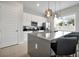 Bright kitchen with an island, bar stool seating, stainless appliances, and a window at 7740 Sandy Ridge Dr # 114, Reunion, FL 34747