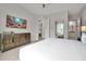 Spacious bedroom featuring a large bed, wooden dresser, and TV at 7740 Sandy Ridge Dr # 114, Reunion, FL 34747