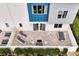 An aerial view shows the modern townhome exteriors with furnished patios for outdoor relaxation at 7740 Sandy Ridge Dr # 114, Reunion, FL 34747