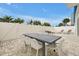 A spacious patio is furnished with a dining table and chairs, perfect for outdoor gatherings at 7740 Sandy Ridge Dr # 114, Reunion, FL 34747