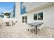 A well-appointed patio features outdoor seating and a paved area for entertainment and relaxation at 7740 Sandy Ridge Dr # 114, Reunion, FL 34747
