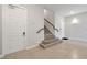 Inviting stairway featuring wood railing and a tiled landing at the base of the stairs at 7740 Sandy Ridge Dr # 114, Reunion, FL 34747