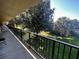 Outdoor balcony overlooking a community green space at 7900 S Orange Blossom Trl # 2108, Orlando, FL 32809