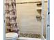 Updated bathroom featuring a tiled shower and modern fixtures at 7900 S Orange Blossom Trl # 2108, Orlando, FL 32809