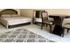 Well-lit bedroom featuring a comfortable bed and tile flooring at 7900 S Orange Blossom Trl # 2108, Orlando, FL 32809