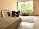 Cozy bedroom with natural light and tile flooring at 7900 S Orange Blossom Trl # 2108, Orlando, FL 32809