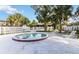Outdoor community pool and hot tub area with lounge seating and landscaping at 7900 S Orange Blossom Trl # 2108, Orlando, FL 32809