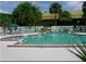 Community pool featuring clear blue water with surrounding lounge seating at 7900 S Orange Blossom Trl # 2108, Orlando, FL 32809