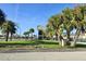 Street view of the Heritage Hotel sign with palm trees and green space at 7900 S Orange Blossom Trl # 2108, Orlando, FL 32809