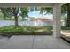 View of spacious backyard and enclosed pool from the covered patio at 809 Kazaros Cir, Ocoee, FL 34761