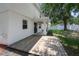 Back of house with a wood deck and partially covered patio at 809 Kazaros Cir, Ocoee, FL 34761