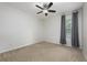 Bedroom with a window dressed with curtains, neutral carpet and ceiling fan at 809 Kazaros Cir, Ocoee, FL 34761