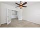 Bedroom offering carpet flooring, french doors, and ceiling fan at 809 Kazaros Cir, Ocoee, FL 34761