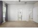 Bedroom with neutral carpet leading to the ensuite bathroom at 809 Kazaros Cir, Ocoee, FL 34761
