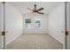 Bedroom with carpet flooring, two windows, and ceiling fan at 809 Kazaros Cir, Ocoee, FL 34761