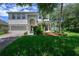 Charming two-story home with stone accents, manicured lawn and lush landscaping at 809 Kazaros Cir, Ocoee, FL 34761