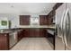 Well-equipped kitchen with stainless steel appliances, and tiled flooring at 809 Kazaros Cir, Ocoee, FL 34761