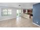 Open kitchen featuring stainless steel appliances, breakfast bar, and access to the backyard at 809 Kazaros Cir, Ocoee, FL 34761