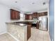 Spacious kitchen with stainless steel appliances, granite countertops and tiled flooring at 809 Kazaros Cir, Ocoee, FL 34761