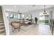 Staged living room with tiled flooring, with backyard views at 809 Kazaros Cir, Ocoee, FL 34761