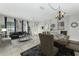 Open-concept living and dining area with elegant decor and natural light at 809 Kazaros Cir, Ocoee, FL 34761