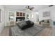 Tastefully furnished main bedroom with a plush rug, ceiling fan, and artwork at 809 Kazaros Cir, Ocoee, FL 34761
