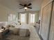 Stylishly staged bedroom with a ceiling fan and neutral color scheme at 8320 Dominguin St, Orlando, FL 32817