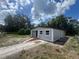 Well-maintained single-story home with a sidewalk, fresh exterior paint, and lovely landscaping at 8320 Dominguin St, Orlando, FL 32817