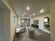 Bright living room featuring recessed lighting, neutral walls, and views to the backyard at 8320 Dominguin St, Orlando, FL 32817