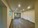 Bright living room with recessed lighting and wood-look floors at 8320 Dominguin St, Orlando, FL 32817