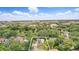 Stunning aerial view of the property nestled among lush trees and close to the city at 835 Antonette Ave, Winter Park, FL 32789