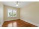 Bedroom featuring hardwood floors, a ceiling fan, and a bright double-window view at 835 Antonette Ave, Winter Park, FL 32789