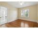 Bedroom featuring hardwood floors, a ceiling fan, and a bright double-window view at 835 Antonette Ave, Winter Park, FL 32789