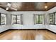 Bedroom featuring hardwood floors, multiple windows, and unique ceiling at 835 Antonette Ave, Winter Park, FL 32789