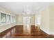 Spacious living room featuring gleaming hardwood floors, a ceiling fan, and bright natural light at 835 Antonette Ave, Winter Park, FL 32789