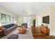 Bright living room with hardwood floors, a ceiling fan, and neutral decor creating a cozy atmosphere at 835 Antonette Ave, Winter Park, FL 32789