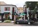 Charming storefronts with awnings line the brick-paved street, showcasing the community's unique character at 835 Antonette Ave, Winter Park, FL 32789