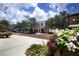 Beautiful street view featuring flowers and buildings with awnings under a sky with fluffy white clouds at 835 Antonette Ave, Winter Park, FL 32789