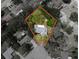 Aerial view of the property highlighting the treed lot and surrounding neighborhood at 8404 Singapore Ct, Orlando, FL 32817