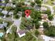 Aerial view showcasing the home's location, backyard, and proximity to local streets at 8404 Singapore Ct, Orlando, FL 32817