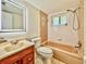 Bathroom featuring tiled shower/tub with updated vanity and mirror, great for a quick refresh at 8404 Singapore Ct, Orlando, FL 32817