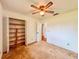 Bedroom featuring spacious closet with custom shelving, ideal for organization and storage at 8404 Singapore Ct, Orlando, FL 32817