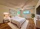 Modern bedroom with bed, stylish decor, a ceiling fan, and sunny windows at 8404 Singapore Ct, Orlando, FL 32817