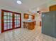 Eat-in kitchen features a breakfast bar, stainless steel refrigerator and access to the screened in lanai at 8404 Singapore Ct, Orlando, FL 32817