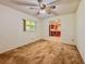 Inviting living room with neutral walls and carpet adjacent to the kitchen, ideal for Gathering gatherings at 8404 Singapore Ct, Orlando, FL 32817