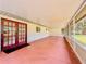 Spacious screened patio with double doors, offering indoor/outdoor living space at 8404 Singapore Ct, Orlando, FL 32817