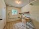 The utility room features a laundry sink, shelving and a window for natural light at 8404 Singapore Ct, Orlando, FL 32817